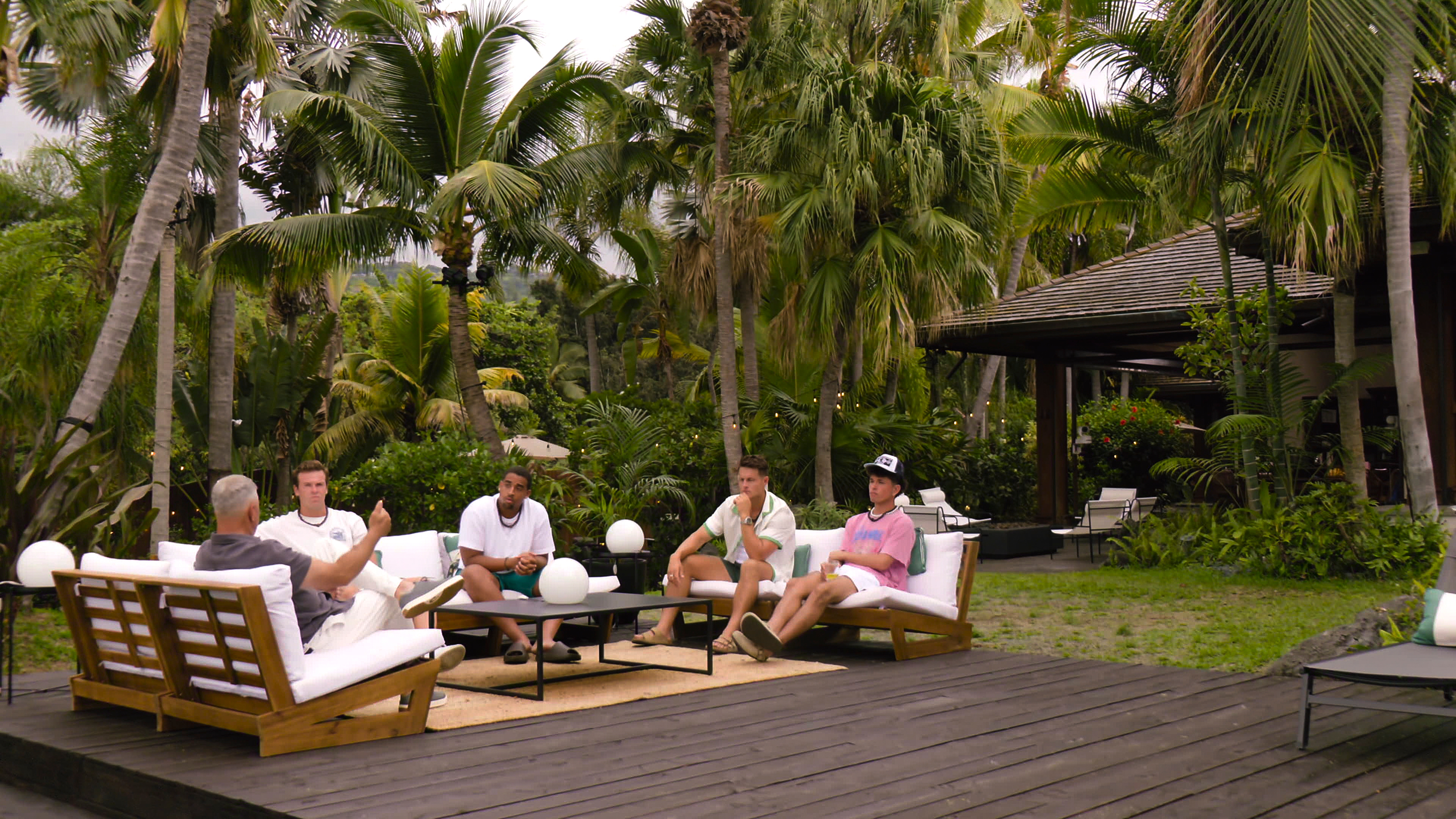 Mark L. Walberg sits with 'Temptation Island's male cast (l-r Summit Wallace, Mikey Bivens, Cole Mueller, Jack Mason) at a villa in Hawaii