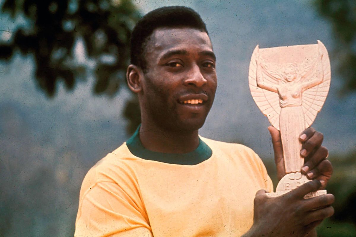 Pele holds the Jules Rimet trophy following Brazil's victory over Italy in the 1970 World Cup final