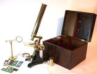 An antique microscope designed to be less expensive. Microscopes were a popular form of entertainment for science-obsessed people living in Victorian-era Britain.