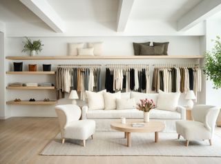 Inside a Jenni Kayne store, with shelves and a lounge area that boast her neutral aesthetic.