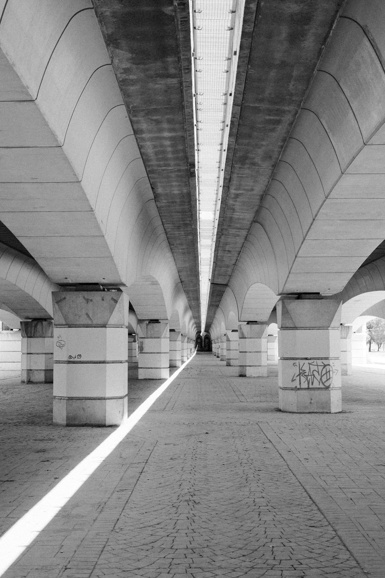 A long path underneath a bridge in Valencia Spain
