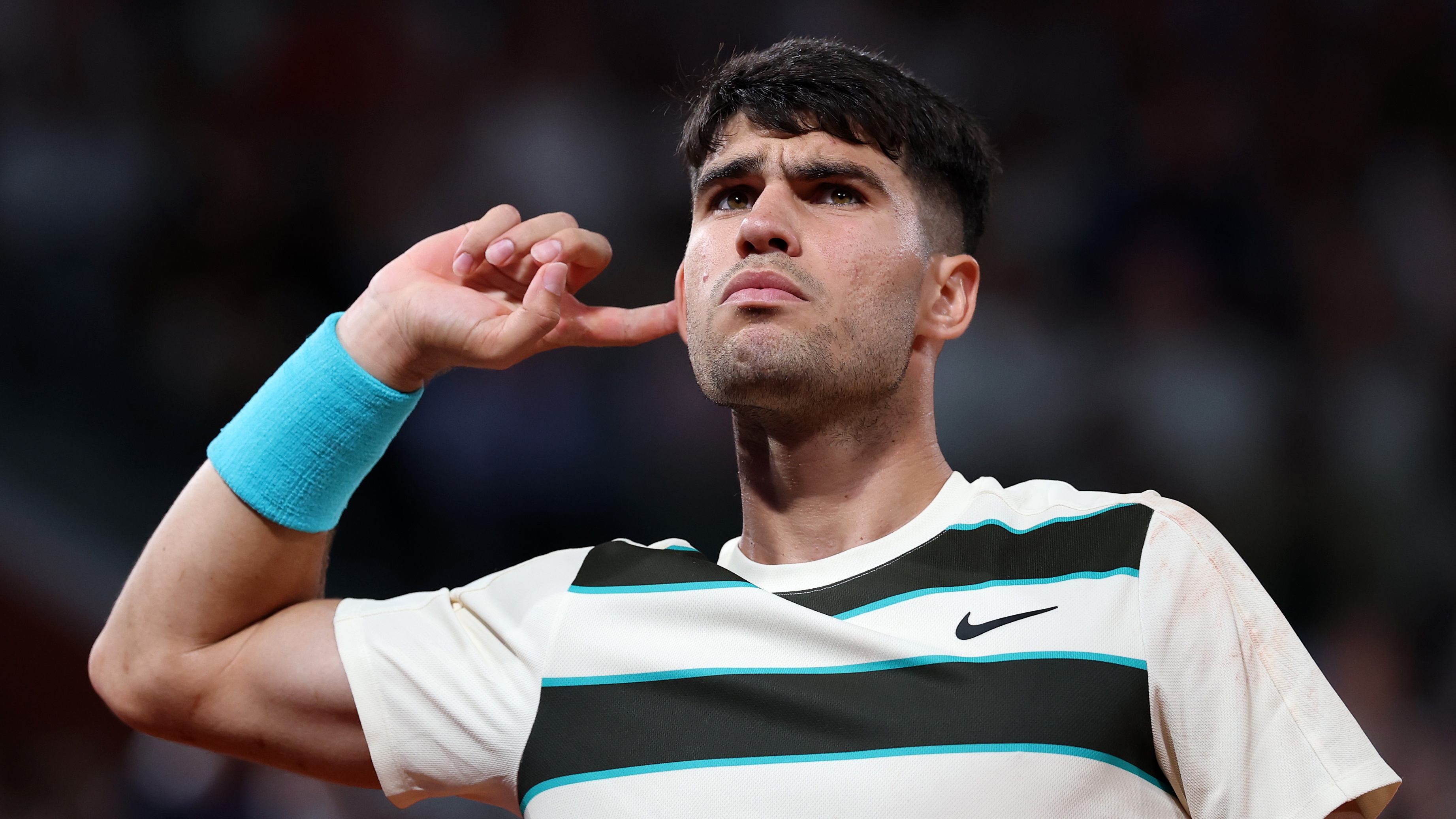 Carlos Alcaraz at the French Open signalling to the crowd