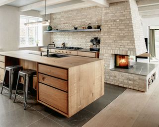 Cozy kitchen with fireplace surround