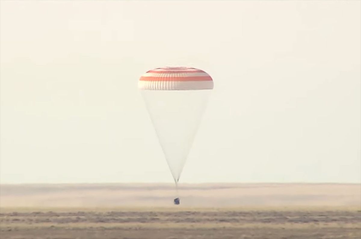 Record-breaking US astronaut and Russian crewmates return to Earth from space st..