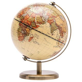 An antique look globe on a brass look stand