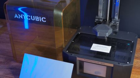 Anycubic Photon Mono M5s in parts on a wooden table