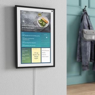 An Amazon Echo Show 15 vertically attached to a wall