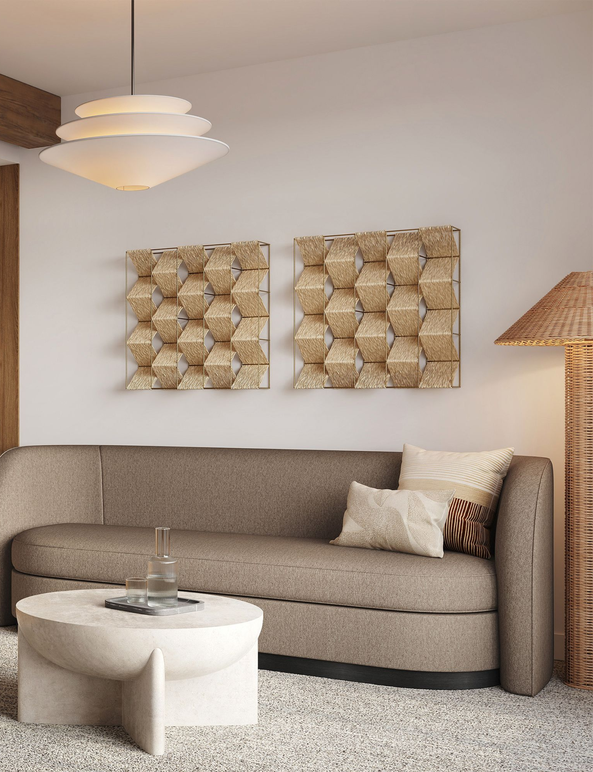 Curved West Elm sleeper sofa styled in an art-filled living room