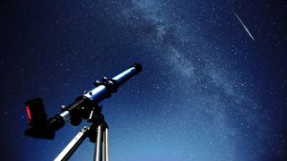 Telescope against a starry night