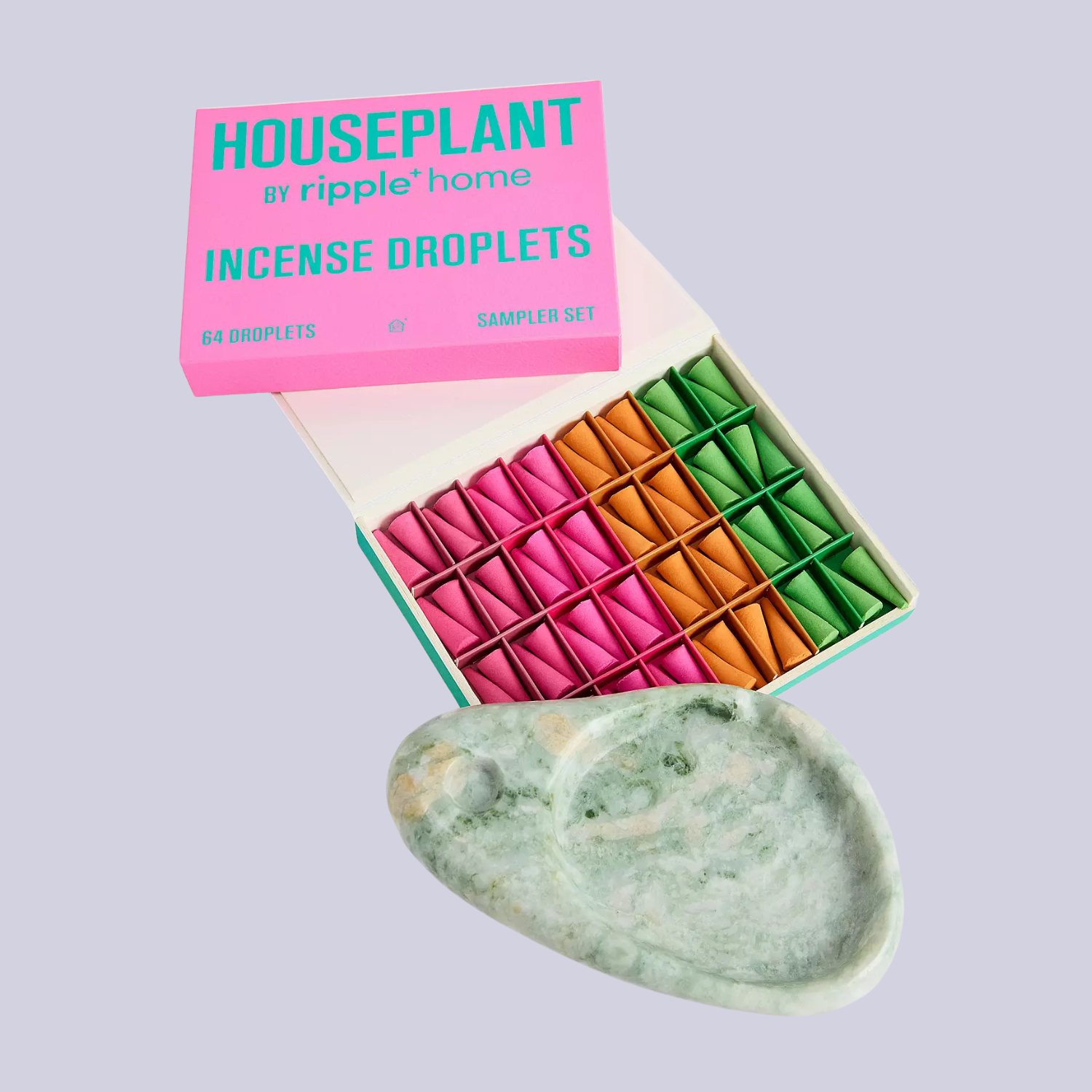 A box of colorful incense droplets and a marble tray