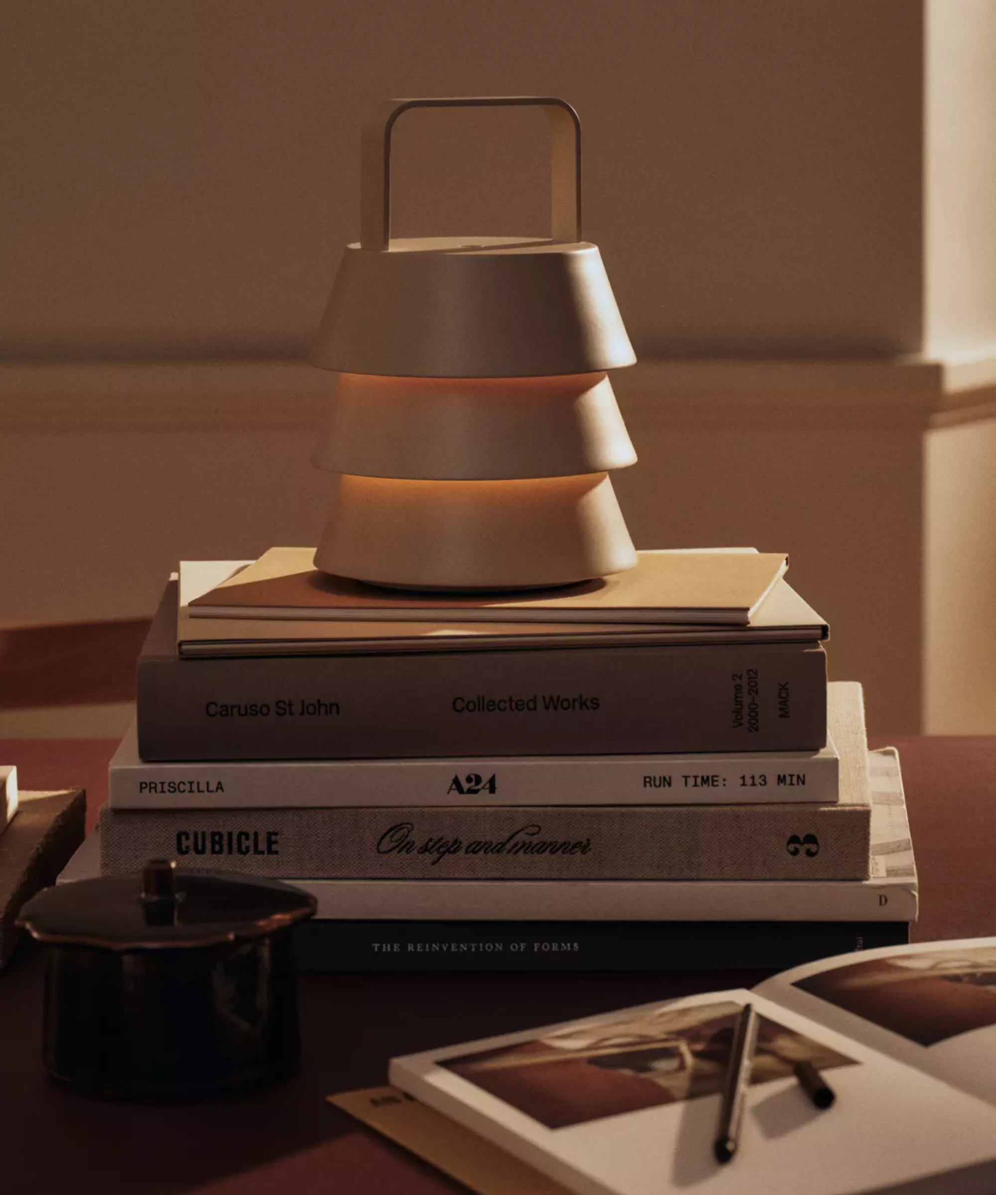 a lamp on a stack of books
