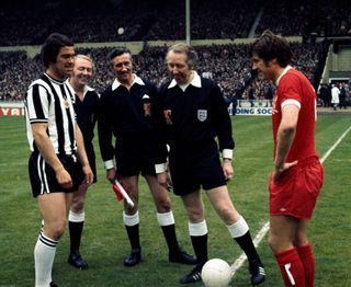 Newcastle United captain Bobby Moncur and Liverpool captain Emlyn Hughes at the toss ahead of the 1974 FA Cup final at Wembley Stadium