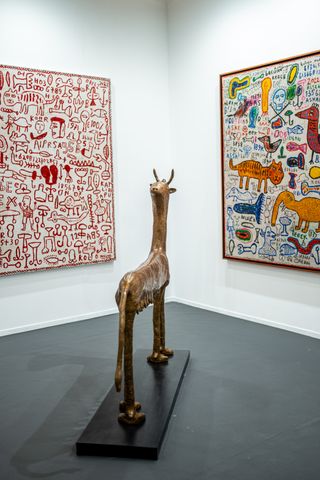 animal sculpture, and artworks on gallery wall