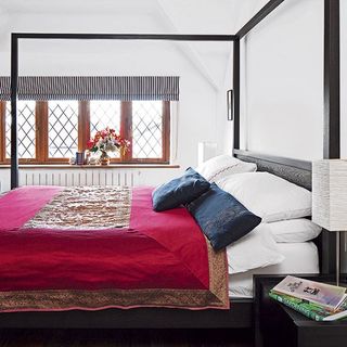 bedroom with white wall and bed