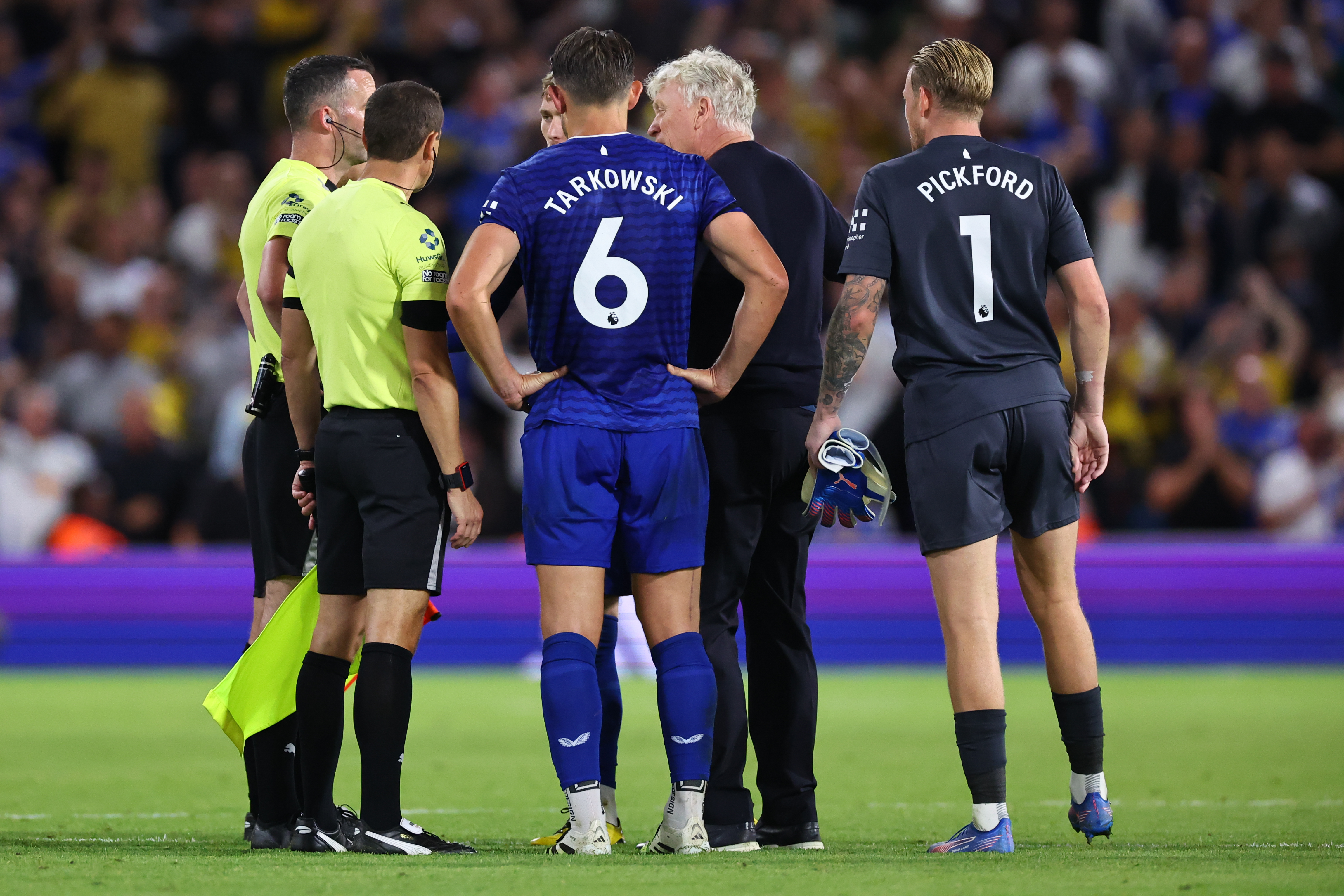 Everton protest the referee's decision to award a penalty after the final whistle at Elland Road