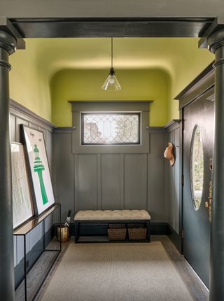 Entrance door with bright green ceiling at Alameda Renovation