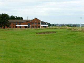 The final green on the Shore nine with the welcoming clubhouse behind
