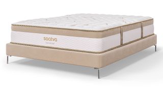Best Saatva mattress sales, deals and discount codes: The Saatva Loom & Leaf Mattress on a tan coloured bed base