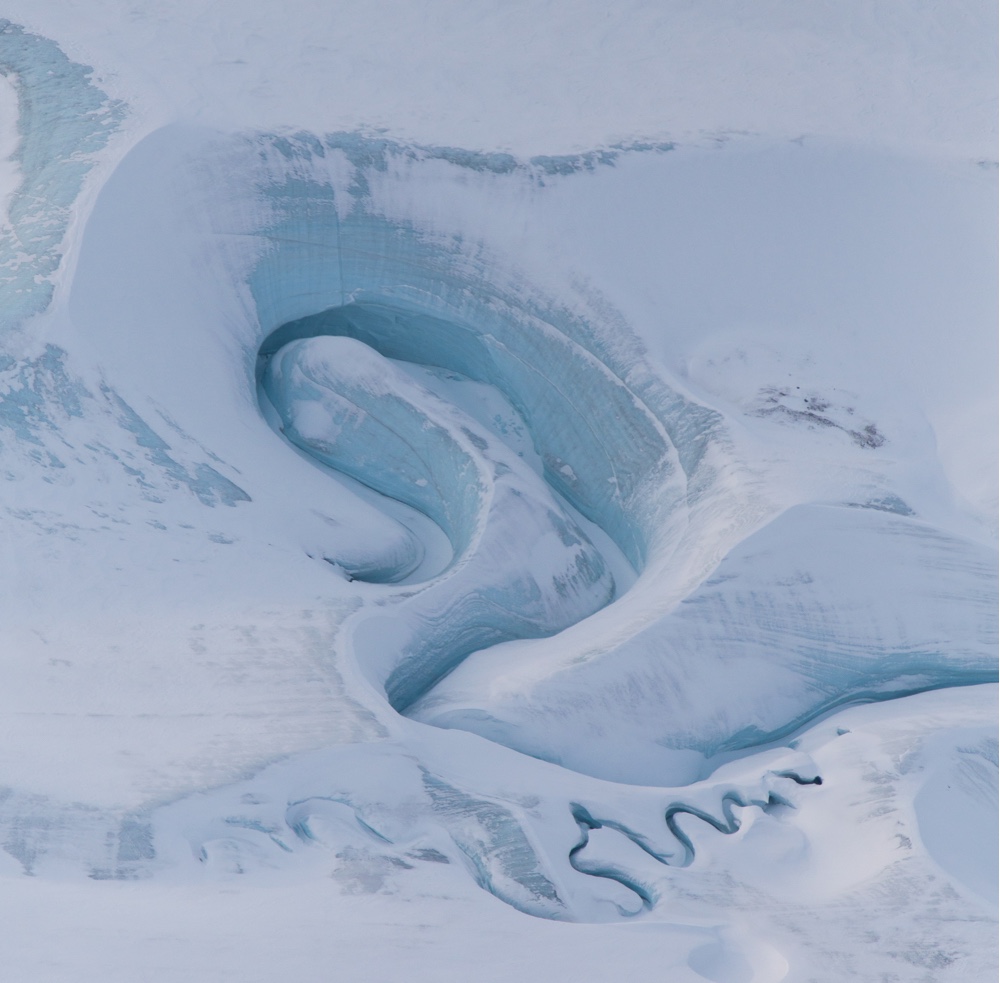 Meltwater channels are carved into DeVries Glacier in the Canadian Arctic. This aerial image was captured on March 29, 2017.