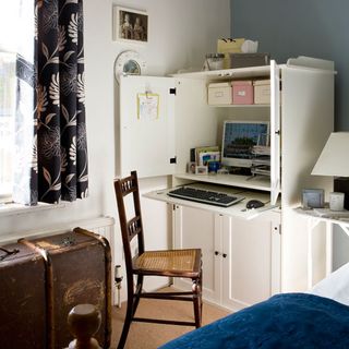 home office storage with chair and computer