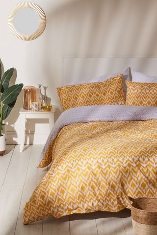 bedroom with yellow tribal bedding