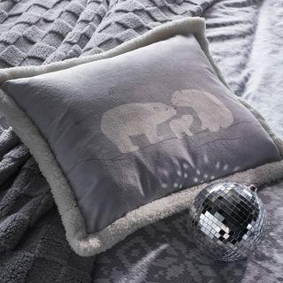 Grey cushion and mini disco ball decoration