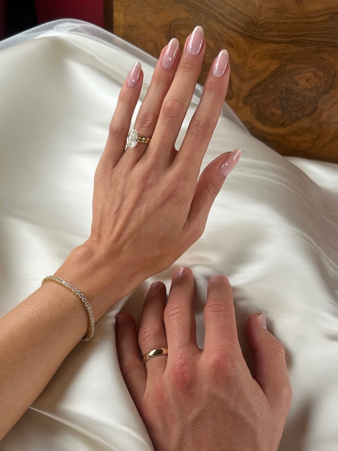 Sheer pink engagement nails.