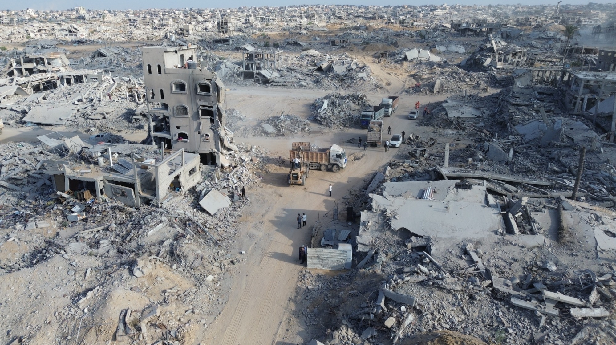 KHAN YUNIS, GAZA - OCTOBER 28: Palestinians try to clear the remains of buildings destroyed by Israeli attacks with limited resources i Khan Yunis, Gaza on October 28, 2025.