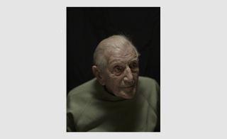 portrait of old man with black background