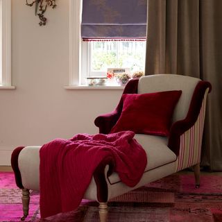 bedroom with red velvet cushion