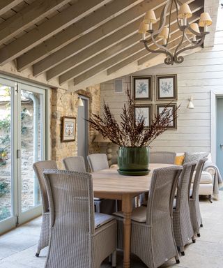 Dining room in a Sims Hilditch extension with wicker chairs