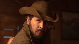 Rip in cowboy hat giving someone a stern face in Dutton Ranch Episode 105