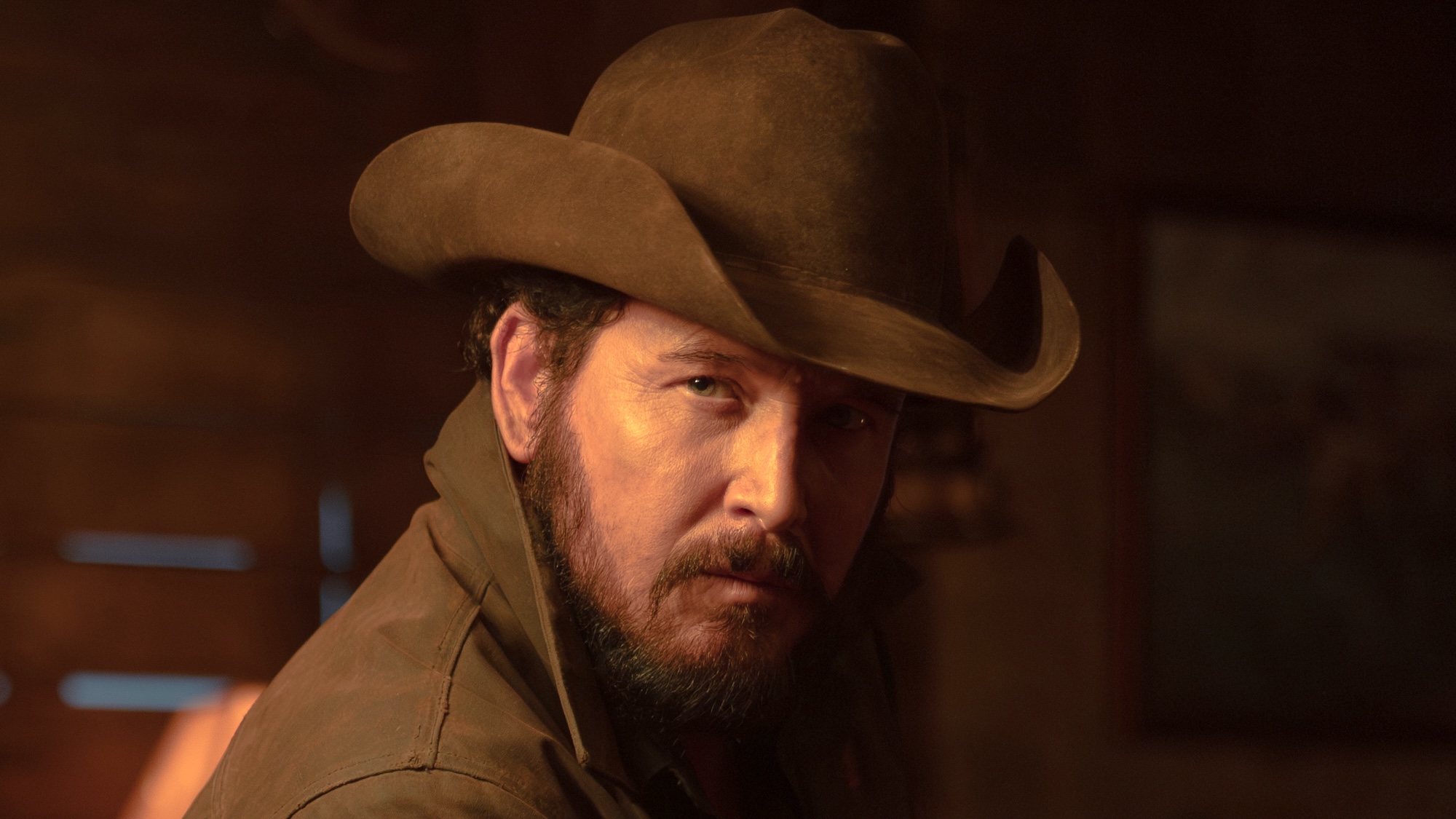 Rip in cowboy hat giving someone a stern face in Dutton Ranch Episode 105