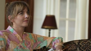 Ophelia Lovibond as Joyce sitting down in Minx