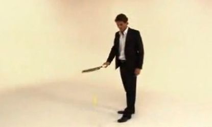 The clip shows Federer hitting a bottle off a man's head with incredible accuracy. 