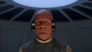 Lobat in Empire Strikes Back with his trademark ear piece.