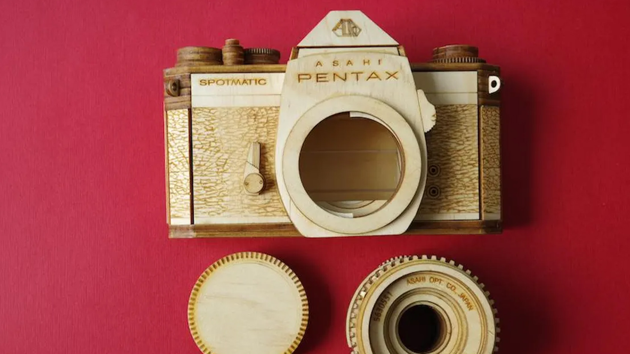 A wooden model Pentax camera.