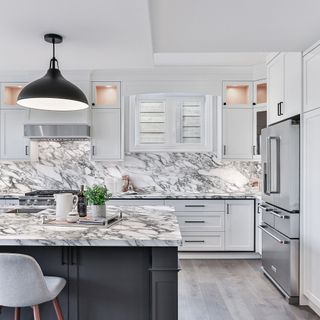 large kitchen with grey island with sintered worktops