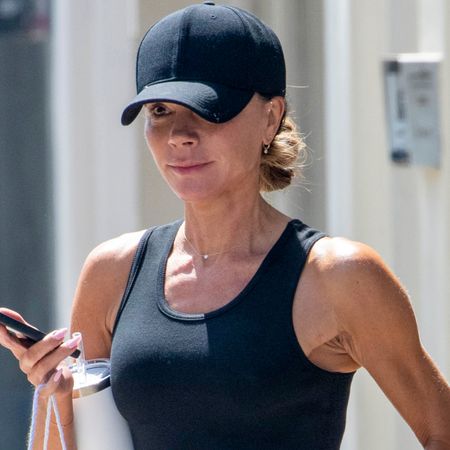 Victoria Beckham styled a surprisingly laid-back look with a black tank top, leggings, and Nike sneakers