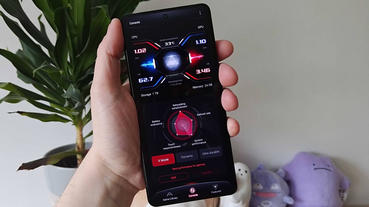 Asus ROG Phone 9 Pro with Armoury Crate software on screen