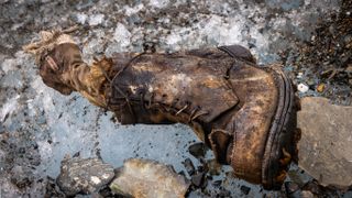 The boot containing a sock bearing Irvine&#039;s name and the remains of a foot.