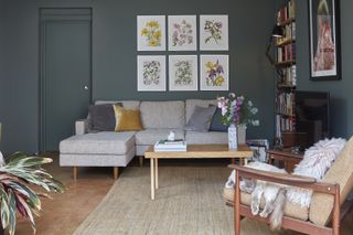 blue living room with gallery wall and cork flooring