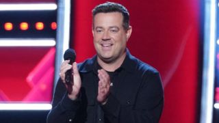 Carson Daly applauds on The Voice.