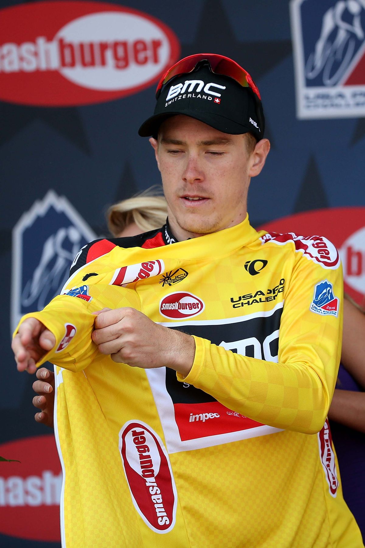Rohan Dennis pulls on the yellow jersey