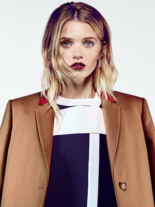 Abbey Lee models a brown jacket.
