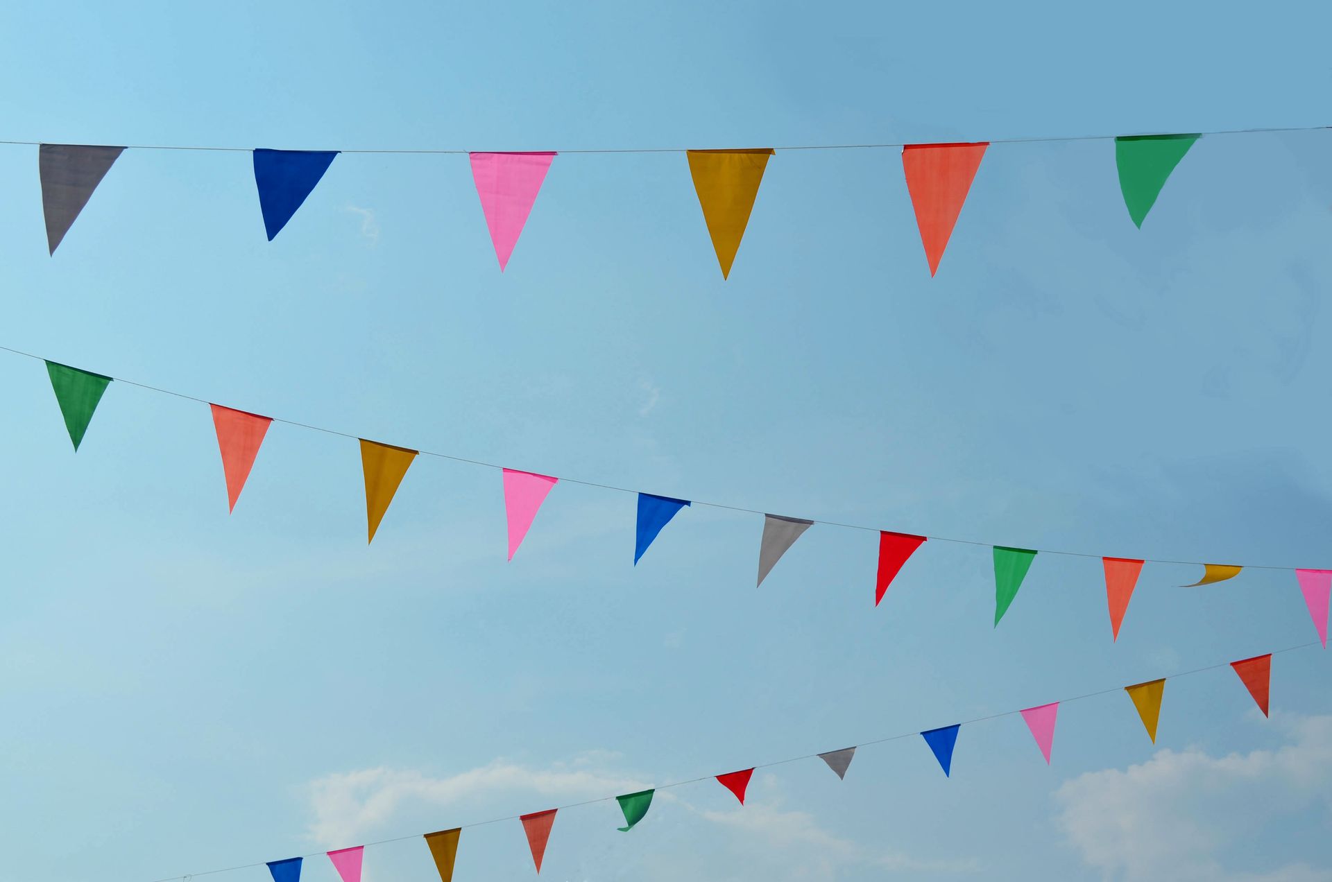 Colorful Triangle Color Flag With Blue Sky Background