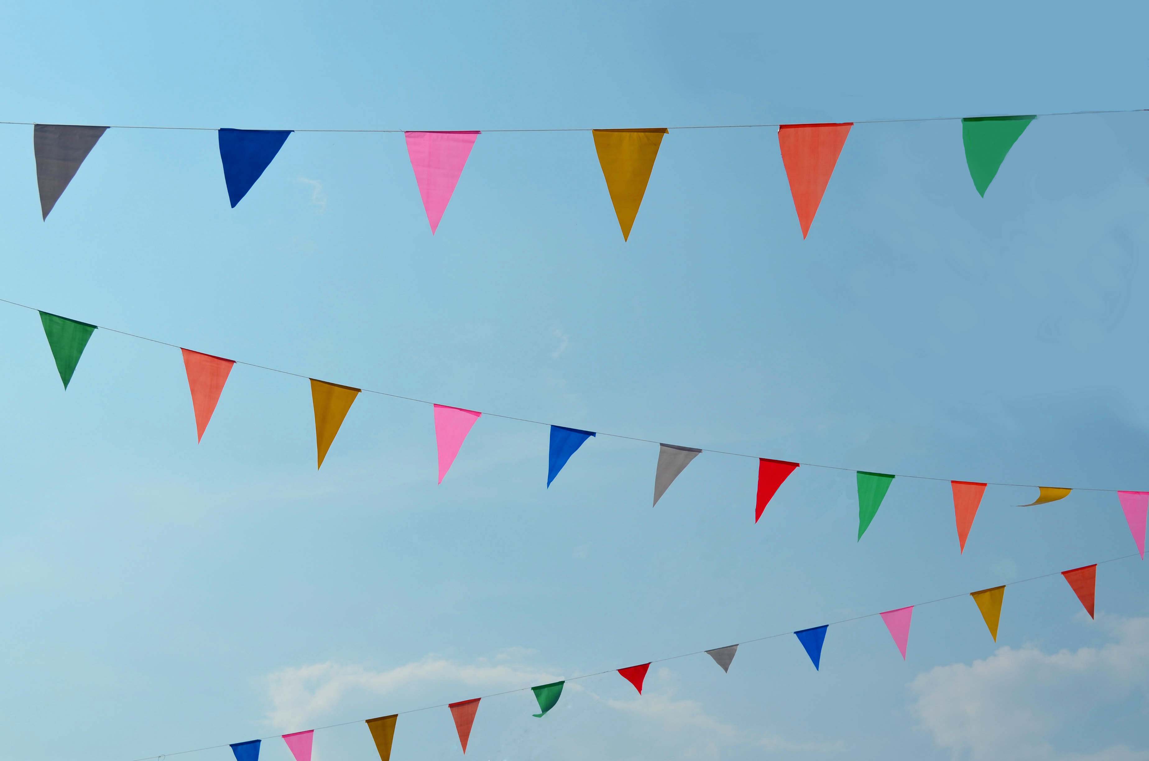 Colorful Triangle Color Flag With Blue Sky Background