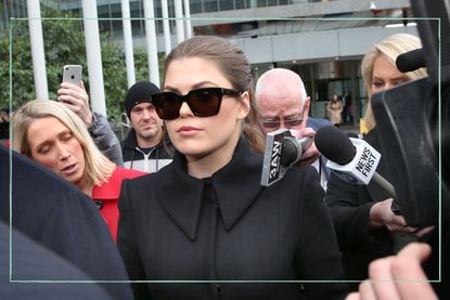 A close up of Belle Gibson leaving court while wearing sunglasses