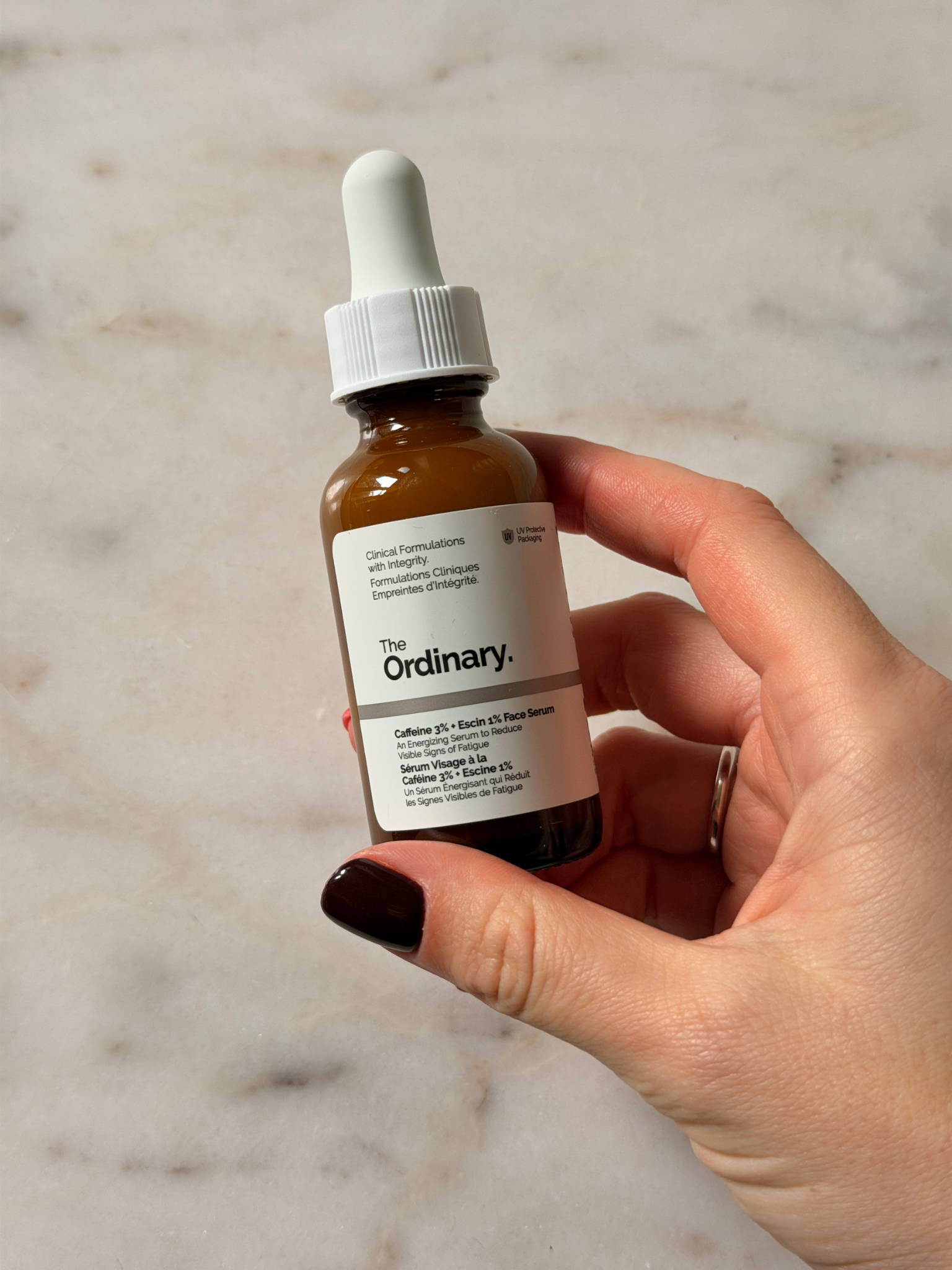 Freelance beauty editor Grace Day holding The Ordinary eye cream