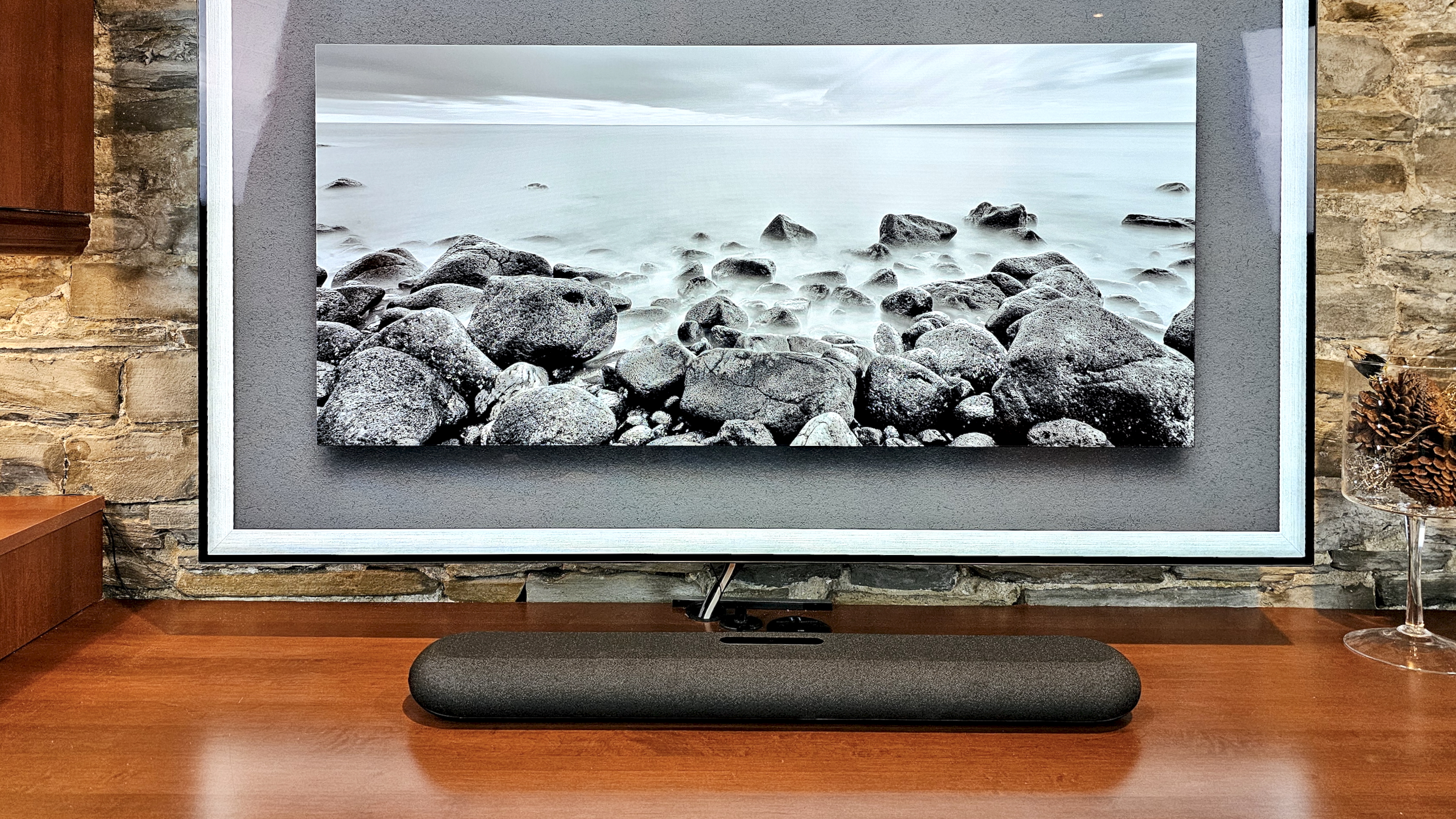 The Bluesound Pulse Mini soundbar underneath a TV